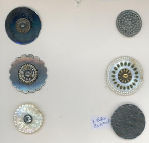 A card of division one steel and pearl buttons.
