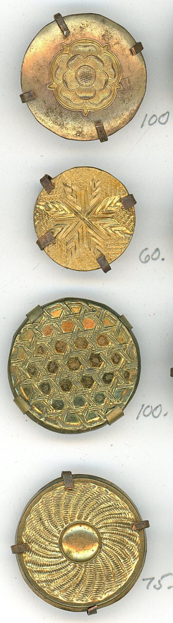 A small card of division one repousse buttons: 4 Medium size 18th century wood back examples. A nice lot of these wood back buttons from the 18th century all having a different pattern on it. Repouss? is a technique of punching form the reverse of