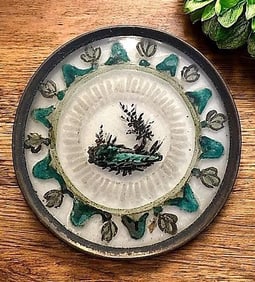 A division one reverse painted glass button