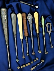 A small selection of old shoe button hooks.