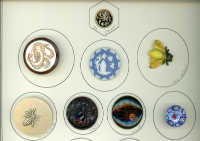 A partial card of div. 1 & 3 assorted material buttons