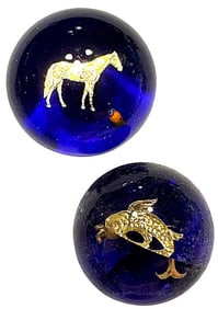 A small card of studio artist glass buttons