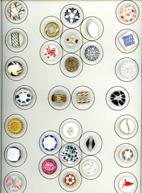 A card of division three glass buttons.