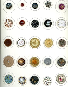 A card of division 1 & 3 assorted material buttons.