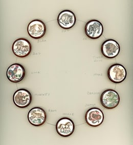 A card of division three bone in wood buttons