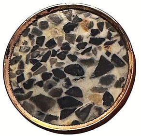 A division 1 mottled Gemstone in metal button