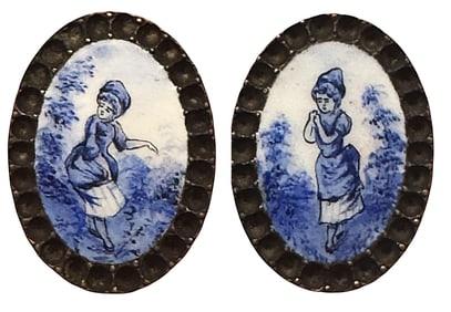 A pair of division one oval figural enamel buttons