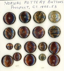 A card of division one pottery buttons