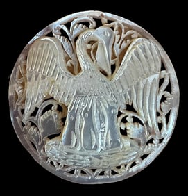 A division three carved and pierced pearl button.