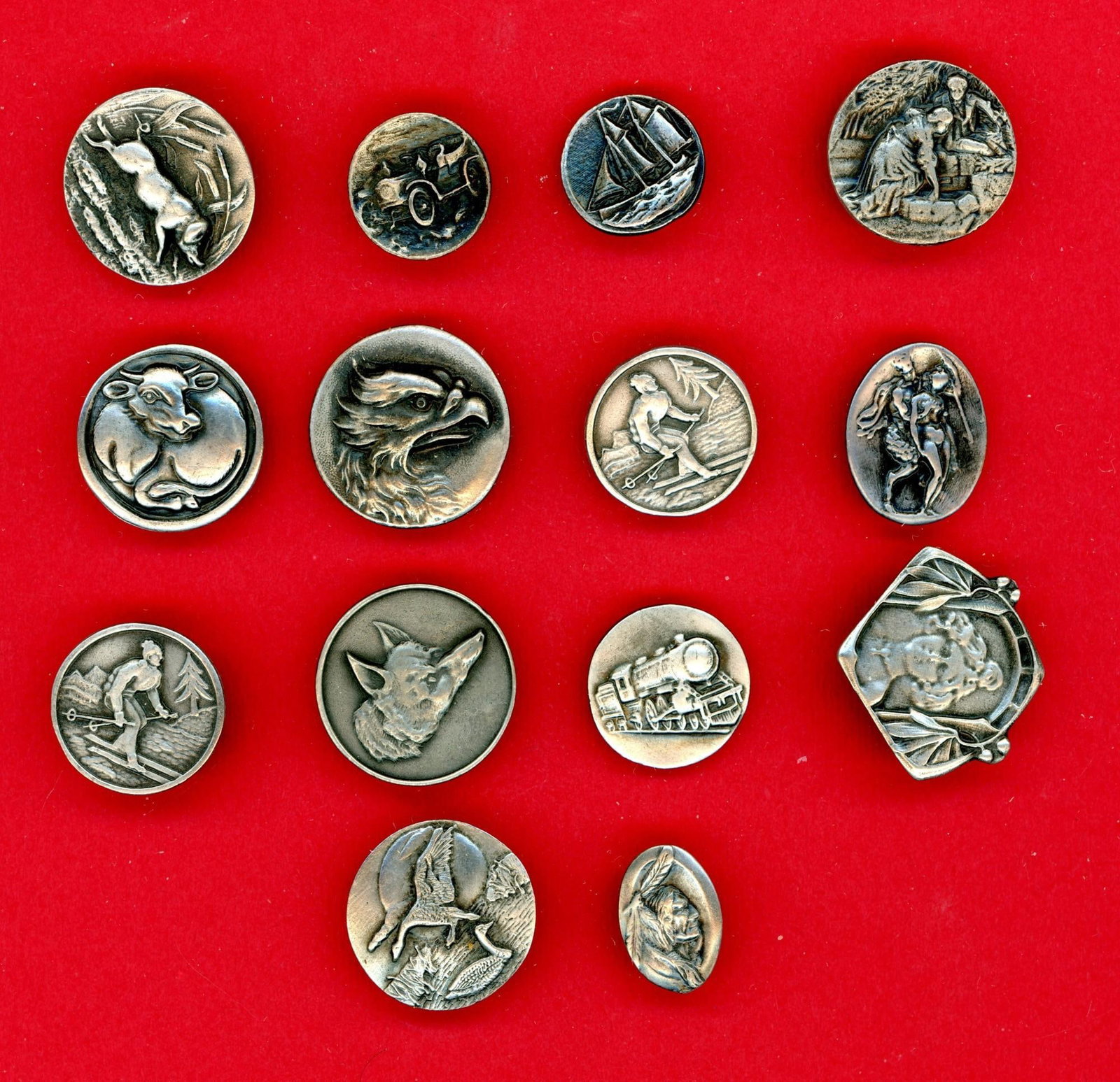 A small card of division three pewter buttons: 14 Small/Medium 20th C. buttons from the Battersea Pewter Co, Here is a nice selection of assorted pictorials from the Wisconsin based company of Battersea Pewter. These desirable buttons only continu