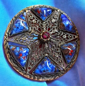 A division one glass in metal button