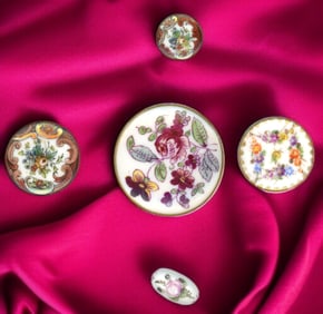 A small card of division one ceramic buttons