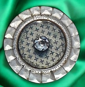 A division one glass in pearl button
