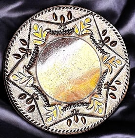 A division one patterned copper button