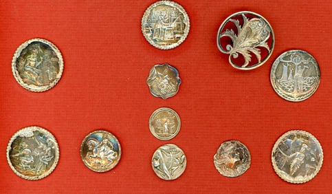 A partial card of assorted hallmarked silver buttons