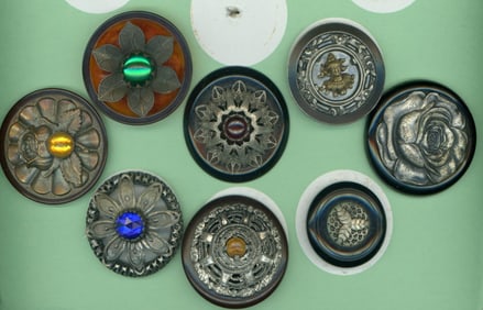 A partial card of division three Bakelite buttons