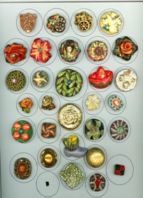 A card of division three plaster buttons