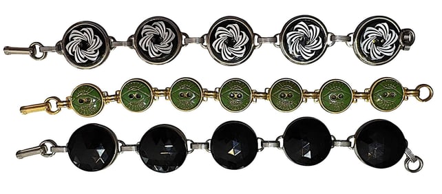 A small group of three handmade bracelets with buttons