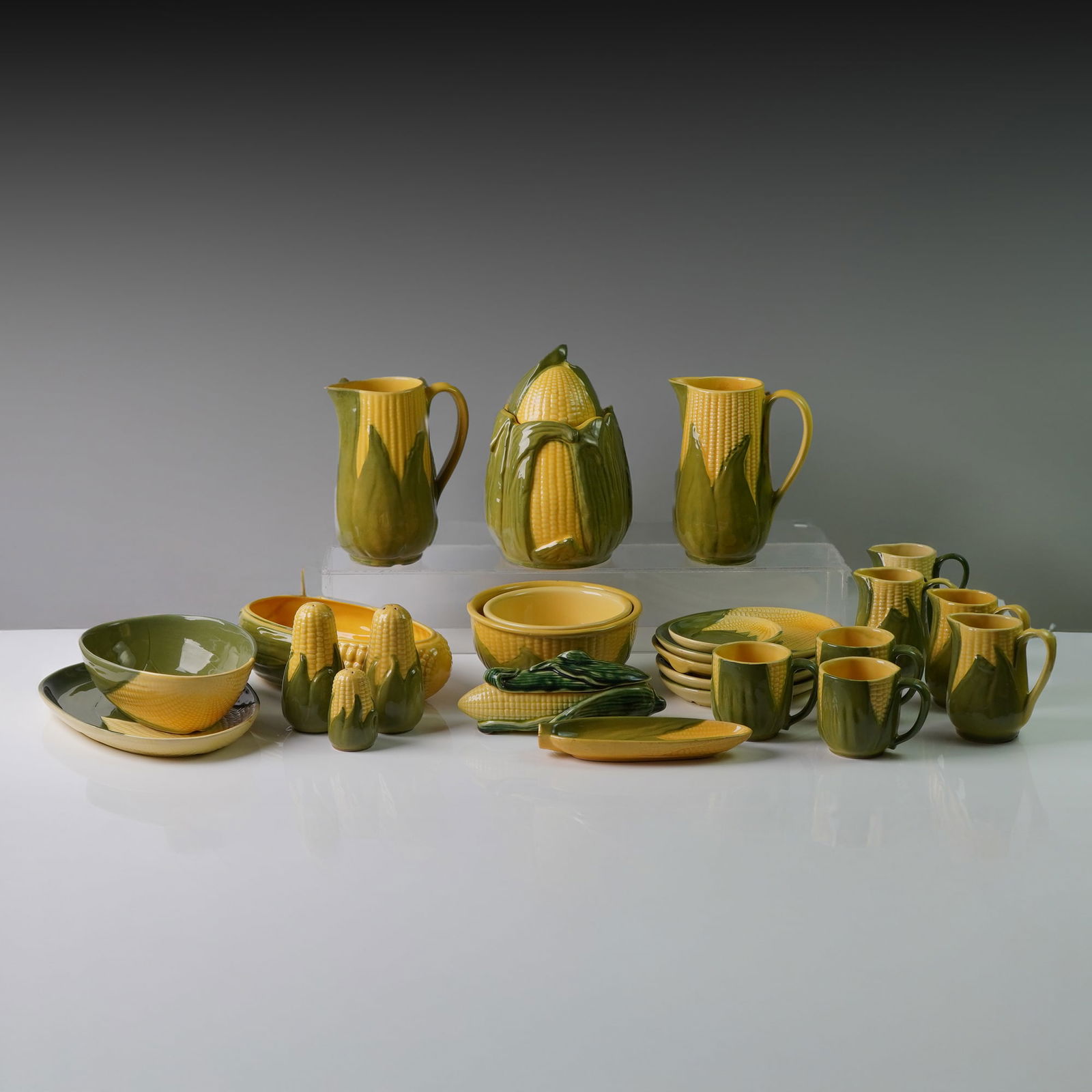 25pc Shawnee Pottery Corn Dinnerware Set: A charming and colorful 25-piece collection of vintage Shawnee Pottery cornware, made in the USA. This iconic mid-20th century dinnerware set is designed in vibrant yellow and green glazed ceramic wit