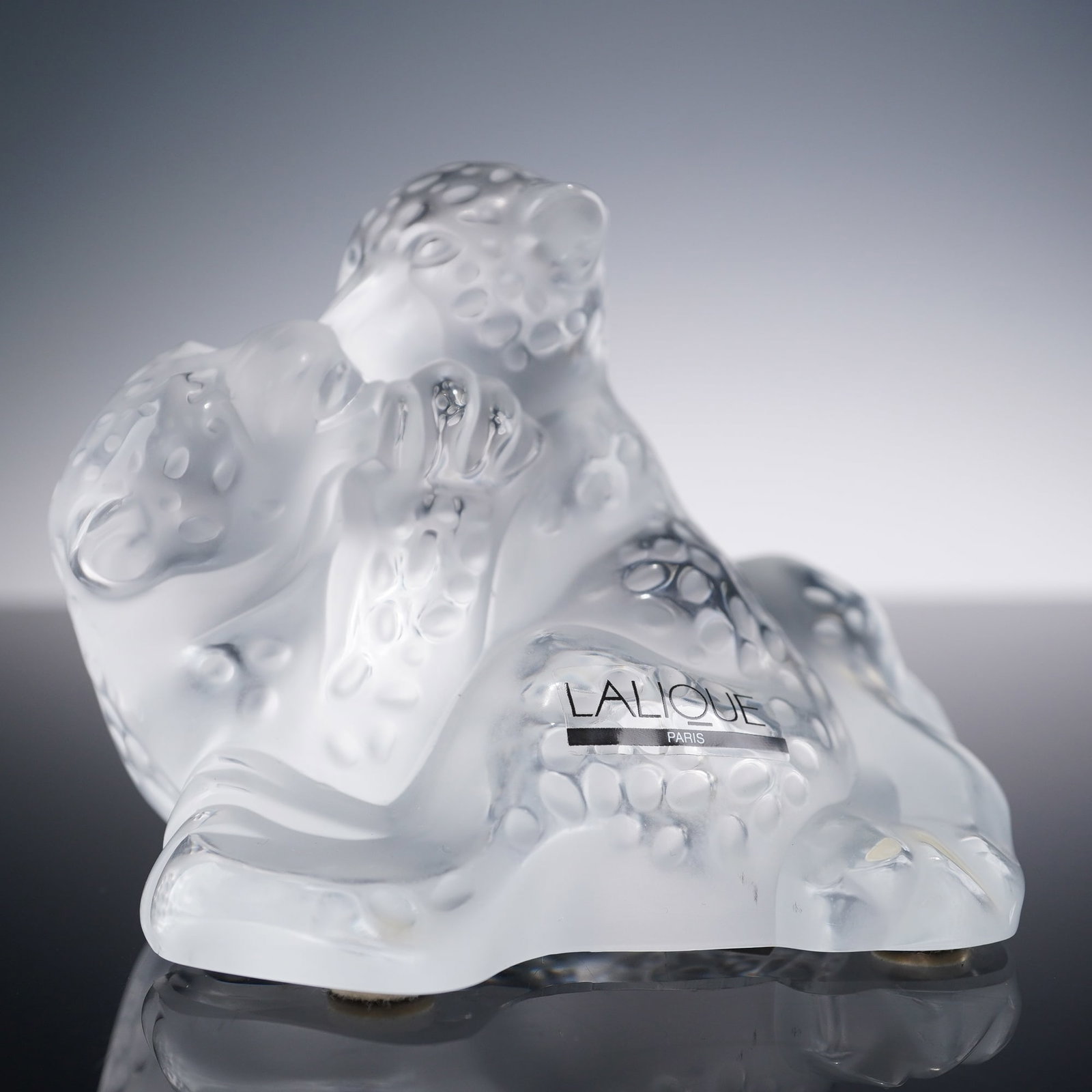 Lalique Crystal Figurine, Jaguar Cubs: Charming crystal sculpture of two jaguar cubs in a playful embrace, crafted in frosted crystal with polished details and a textured spotted surface. The design conveys energy and affection with a sens