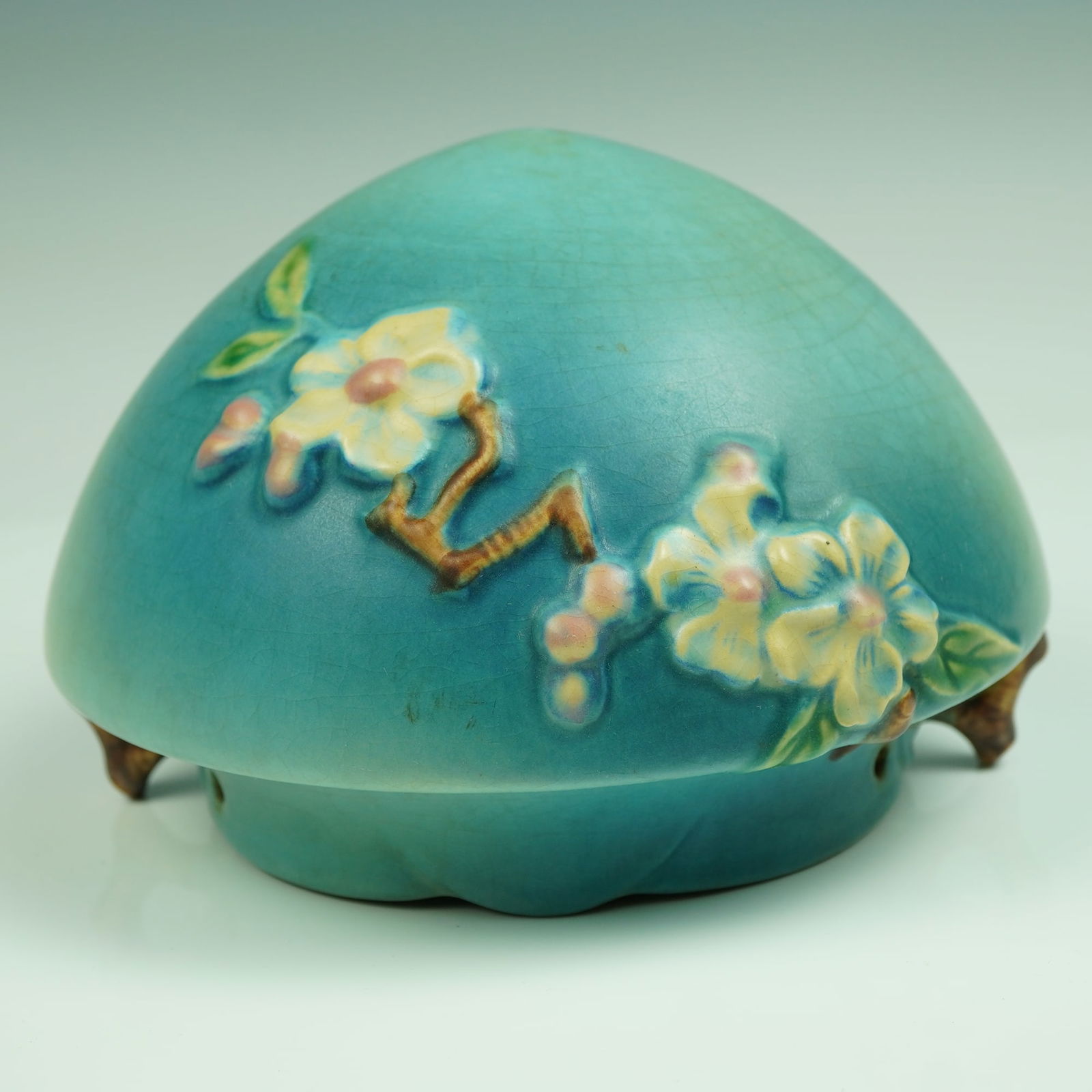 Roseville Pottery Apple Blossom Hanging Planter, Circa 1948: A stunning and rare example of American art pottery, this Roseville Pottery hanging planter from the Apple Blossom line (shape 321-8) exhibits all the hallmarks of postwar design excellence. Molded in