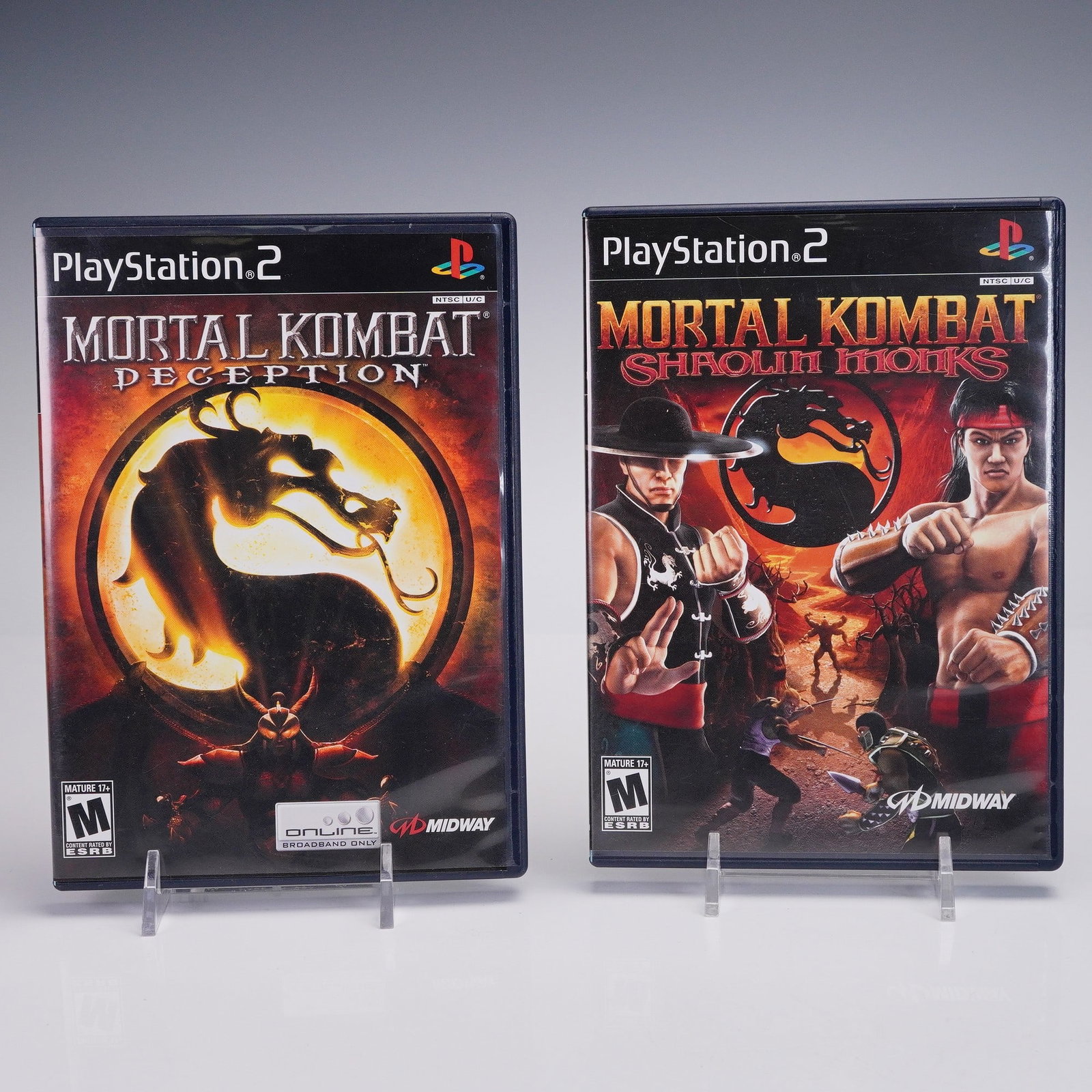2pc PlayStation 2 Mortal Kombat Games, Deception & Shaolin Monks: Two Mortal Kombat titles for the PlayStation 2- Mortal Kombat: Deception and Mortal Kombat: Shaolin Monks. Both games come complete in their original cases with cover art featuring iconic dragon insig
