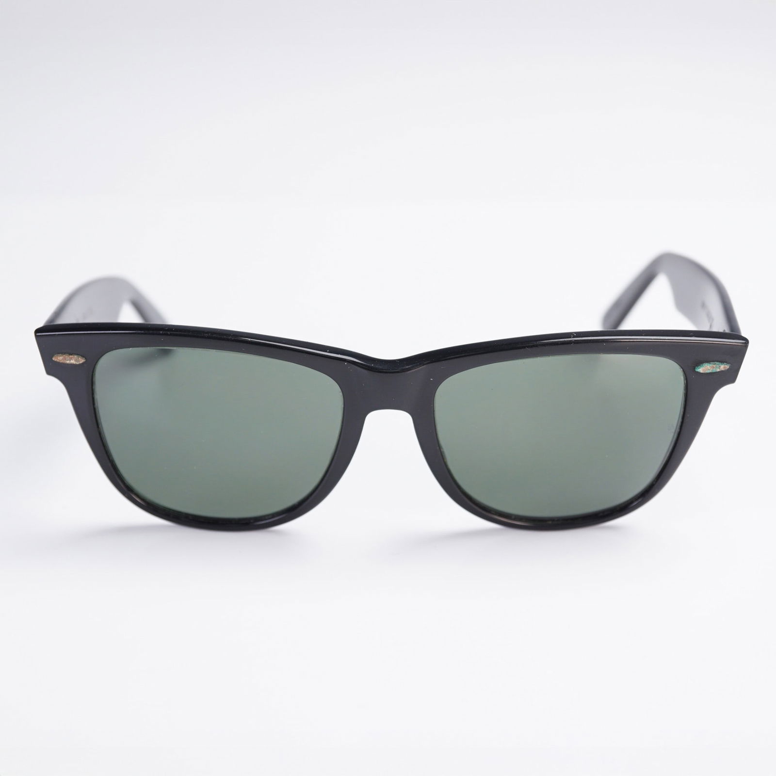 Ray-Ban Wayfarer II Sunglasses, Black Frame, Bausch & Lomb USA: Vintage Ray-Ban Wayfarer II sunglasses with classic black frame and green G-15 mineral glass lenses. Produced by Bausch & Lomb in the U.S.A. prior to Luxottica's acquisition of the brand. Marked B&L R