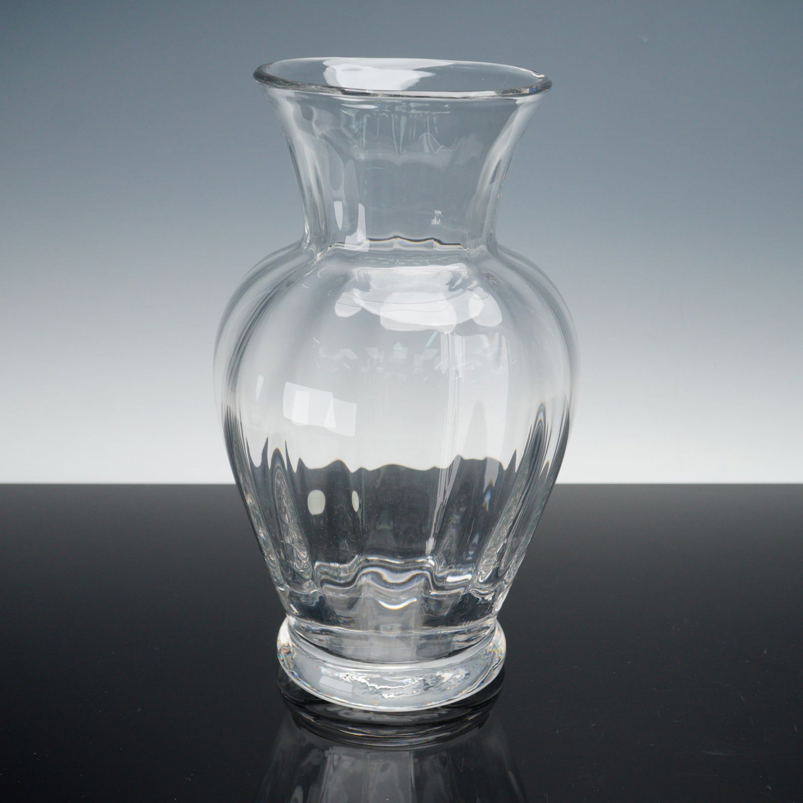 Tiffany & Co. Crystal Vase, Made in England: An exquisite Tiffany & Co. crystal vase, gracefully rising to a wide flared rim and supported on a circular foot. The crystal reflects the timeless craftsmanship for which Tiffany is renowned. Signed