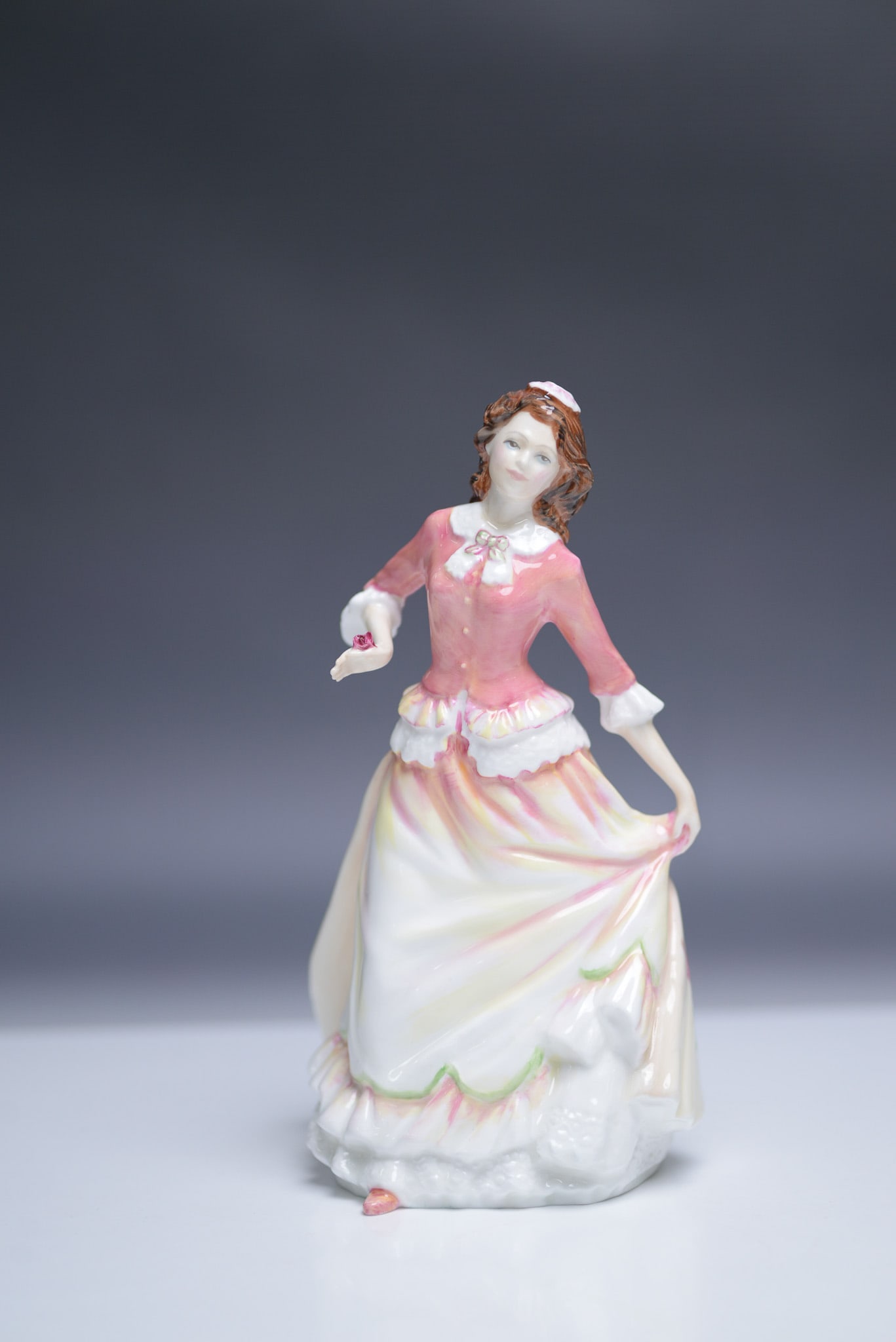 Royal Doulton HN 3871 Susan Figurine Collectors Club: A special Royal Doulton figurine titled Susan, model number HN 3871, issued exclusively for the Royal Doulton International Collectors Club in 1997. Designed by Nada Pedley, this elegant bone china fi