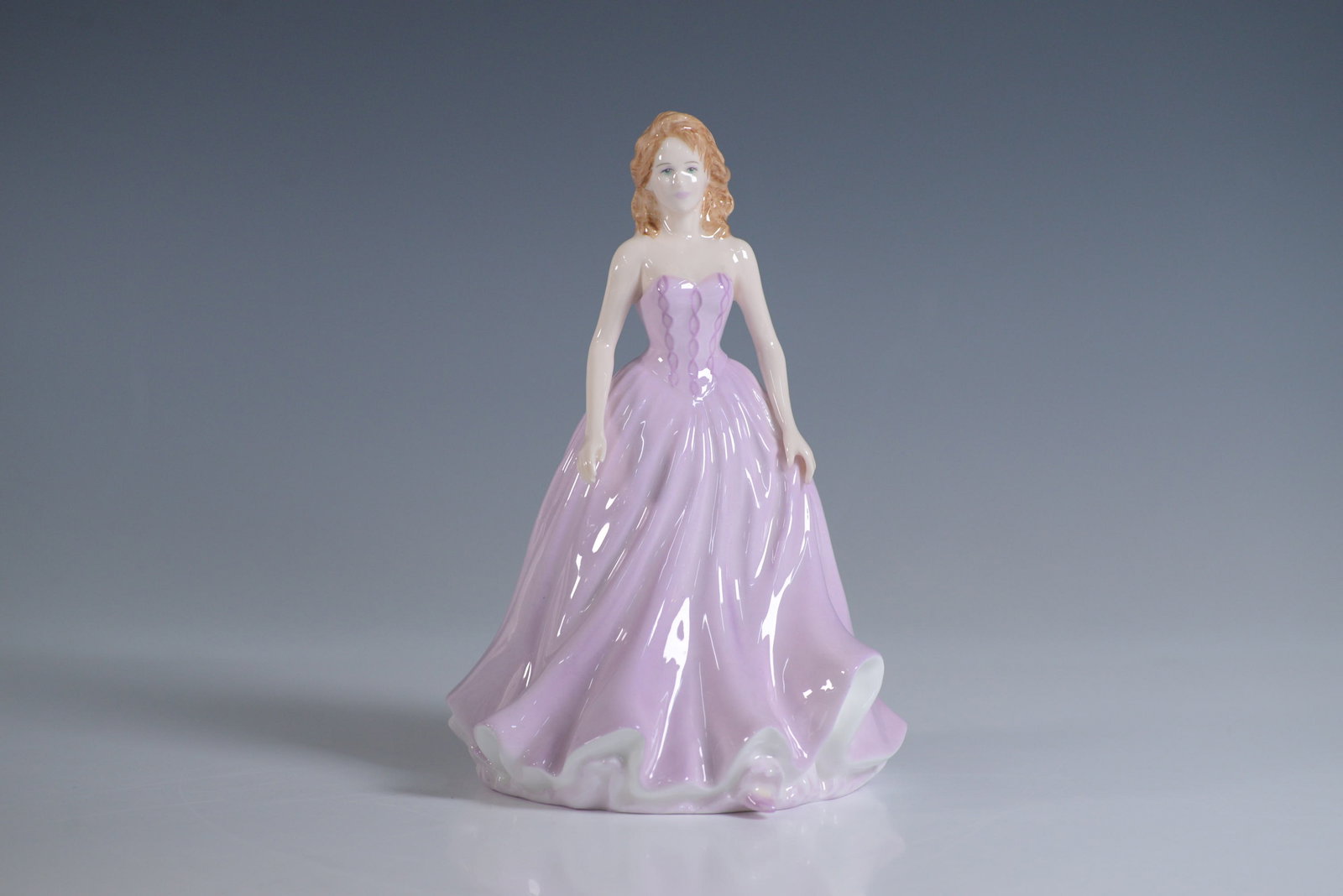 Royal Doulton Classics Figurine, Naomi HN4661: This exquisite Royal Doulton figurine, titled Naomi HN4661, was designed by Nada M Pedley and introduced in 2003. Handcrafted in England from fine bone china, the piece features a graceful woman in a