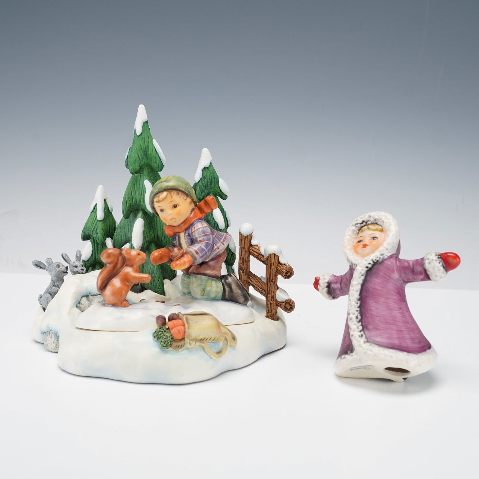 3pc Goebel Hummel Figurine Playful Pals w/ Base & Winter Wonderland: Delightful 3-piece Goebel Hummel porcelain figurines featuring Playful Pals with the scenic Winter Wonderland base and the charming Winter Wonderland depicting a girl ice skating. This enchanting comp