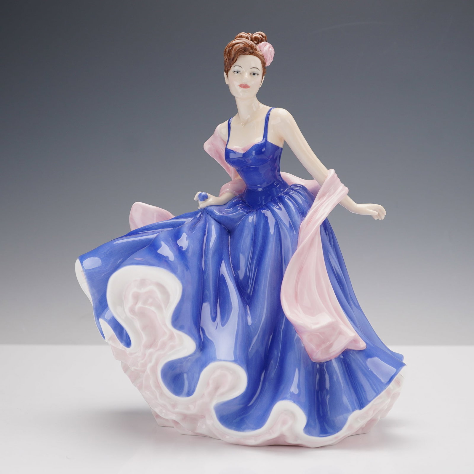 Royal Doulton Pretty Ladies Bone China Figurine, First Love HN5145: Exquisitely crafted and hand-decorated, this figurine features a graceful young woman in a flowing blue gown with soft pink accents, poised elegantly with a delicate pink shawl draped around her shoul
