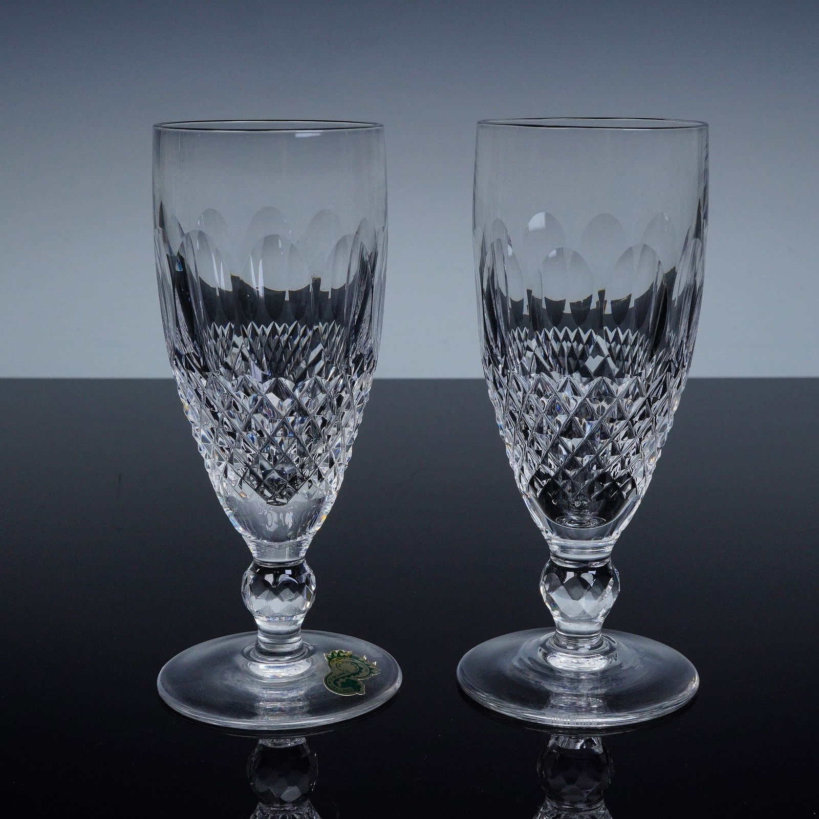 2pc Waterford Crystal Colleen Short Stem Goblets: A beautiful pair of Waterford Crystal goblets in the highly collectible Colleen pattern, short stem variant. Handcrafted in the Republic of Ireland, each glass bears the original green and gold Waterf