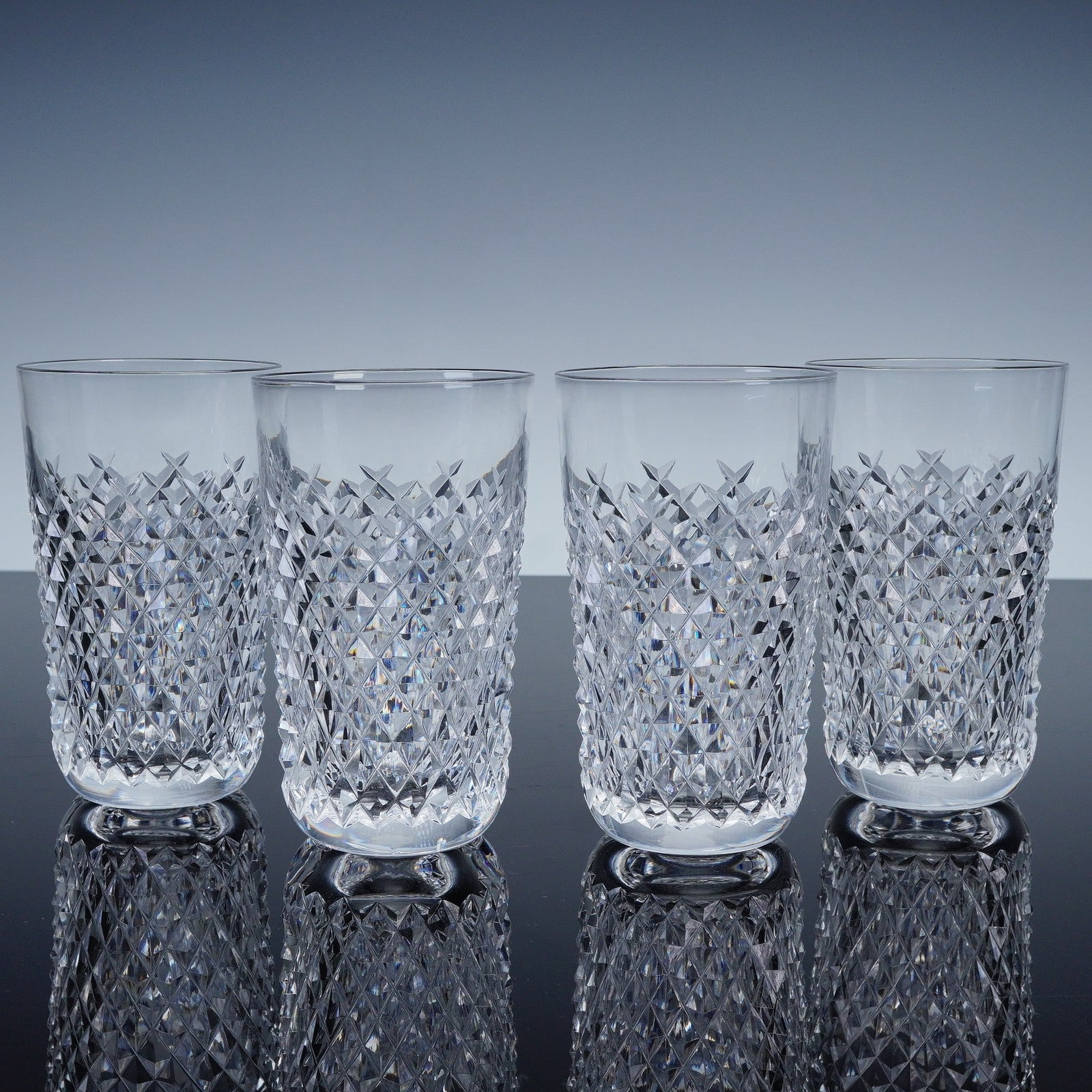 4pc Waterford Alana Crystal Highball Glasses: These elegant tumblers feature straight sides, thick bases, and the classic clarity associated with Waterford crystal. Each glass bears the etched Waterford mark to the base, attesting to its authenti