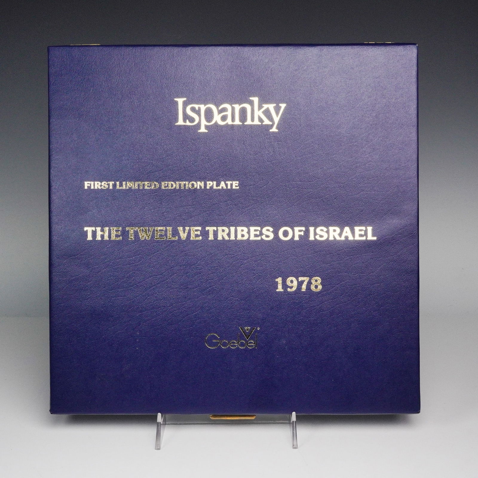 Goebel Hummel First Edition Decorative Plate, The Twelve Tribes of Israel: The porcelain plate features a detailed central portrait surrounded by vibrant symbols representing the twelve tribes, accented with Hebrew script and a decorative border. Backstamp reads "W. Goebel P