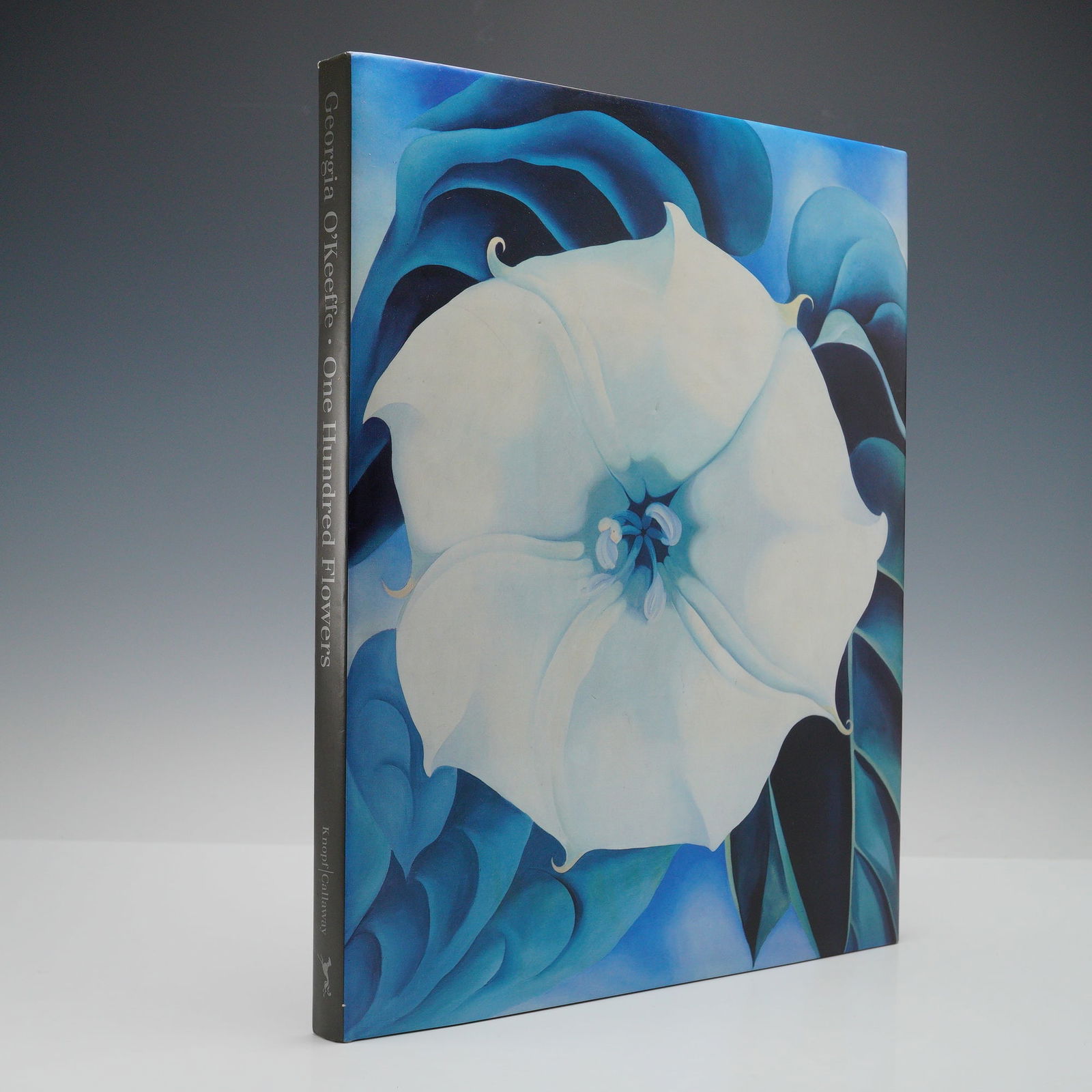 First Edition, Nicholas Callaway (Editor) Hardcover Book Georgia O'Keeffe: This first edition hardcover of Georgia O'Keeffe: One Hundred Flowers, published by Knopf in 1987, gathers many of O'Keeffe's memorable flower paintings. The book includes full-color, close-up photogr