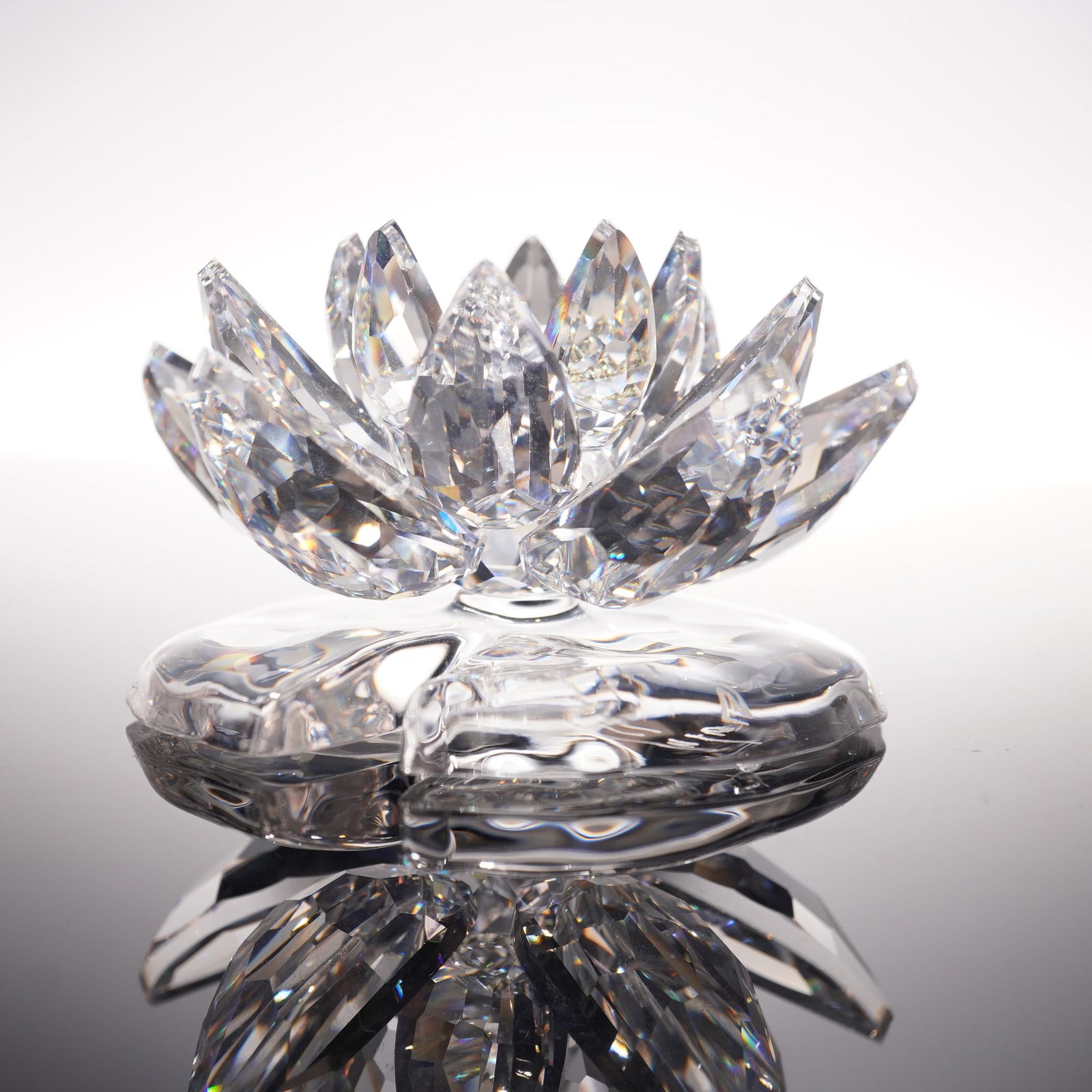 Swarovski Crystal Figurine, Waterlily Large: Swarovski Waterlily Large 838178 crafted in clear faceted crystal with layered petals and smooth base, features Swarovski backstamp, includes original box 5"H. Artist: Anton Hirzinger Issued: 2005-200