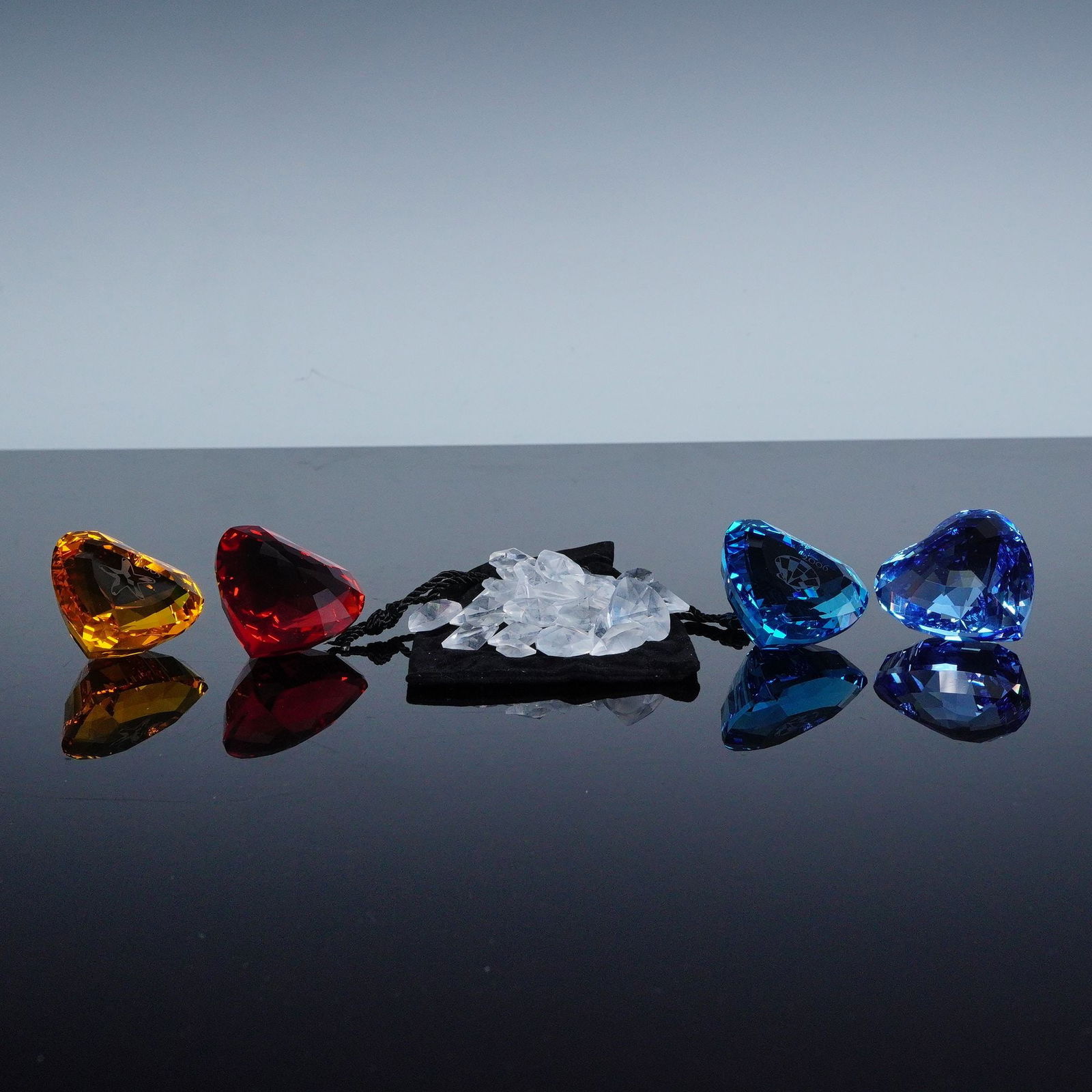 5pc Swarovski SCS Crystal Heart Figurines, Eternity Blue & More: A collection of five faceted crystal heart figurines including Eternity Indicolite blue (844184), Harmony topaz (696974), Heart blue (210899), Heart red (215371), and Love hearts ( 904171). Each featu