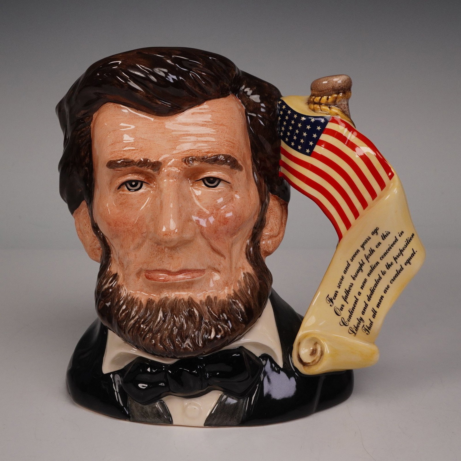 Royal Doulton Large Character Jug, Abraham Lincoln D6936: A limited edition jug honoring President Abraham Lincoln, issued in 1992 as part of the Presidential Series. He is depicted with his thoughtful expression and iconic beard, while the handle shows a sc