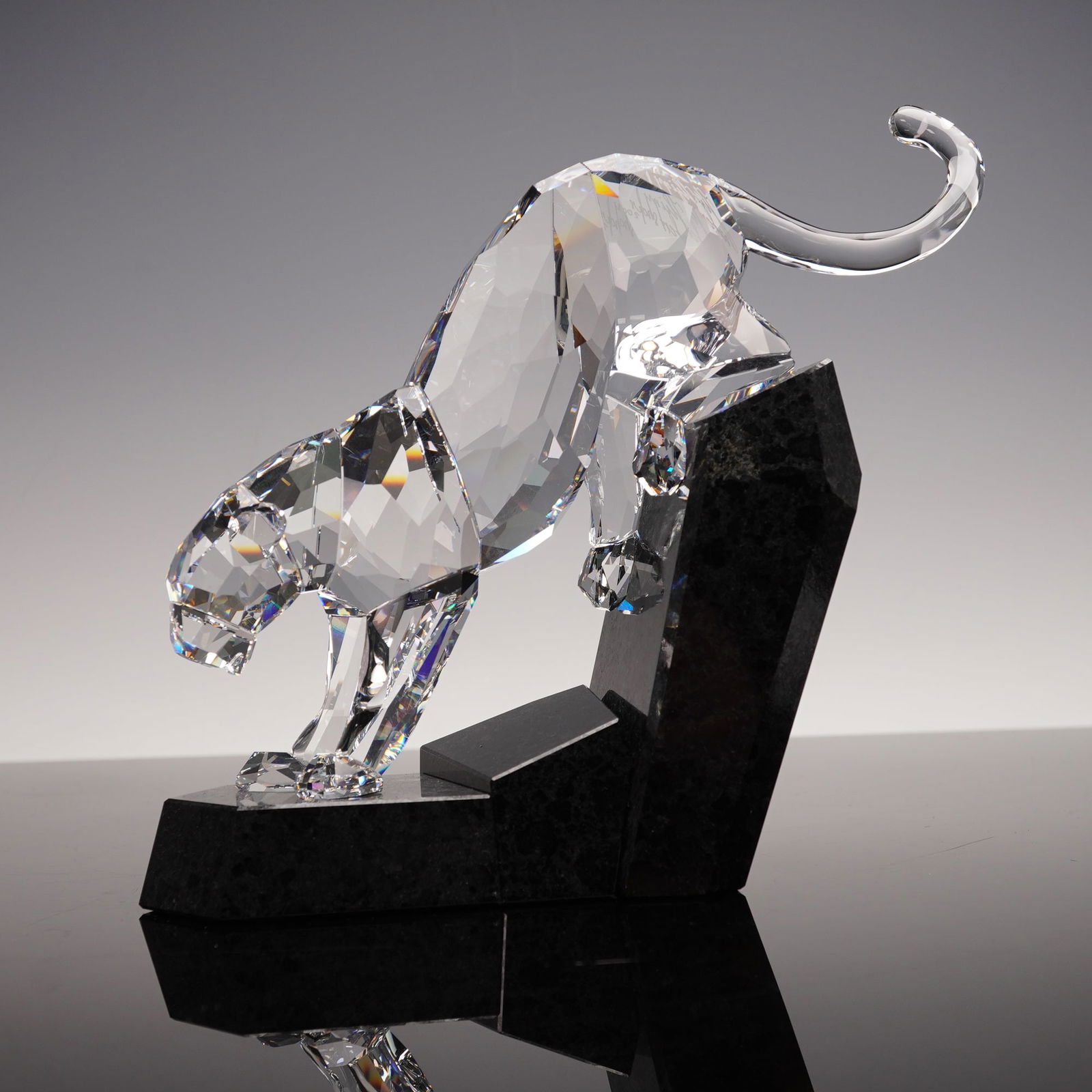 Swarovski Crystal Soulmates Clear Panther on Granite Figurine-Signed: Striking Swarovski Crystal Soulmates Panther, designed and signed by Heinz Tabertshofer. This elegant sculpture depicts a panther poised in a powerful stance atop a polished black granite base, render