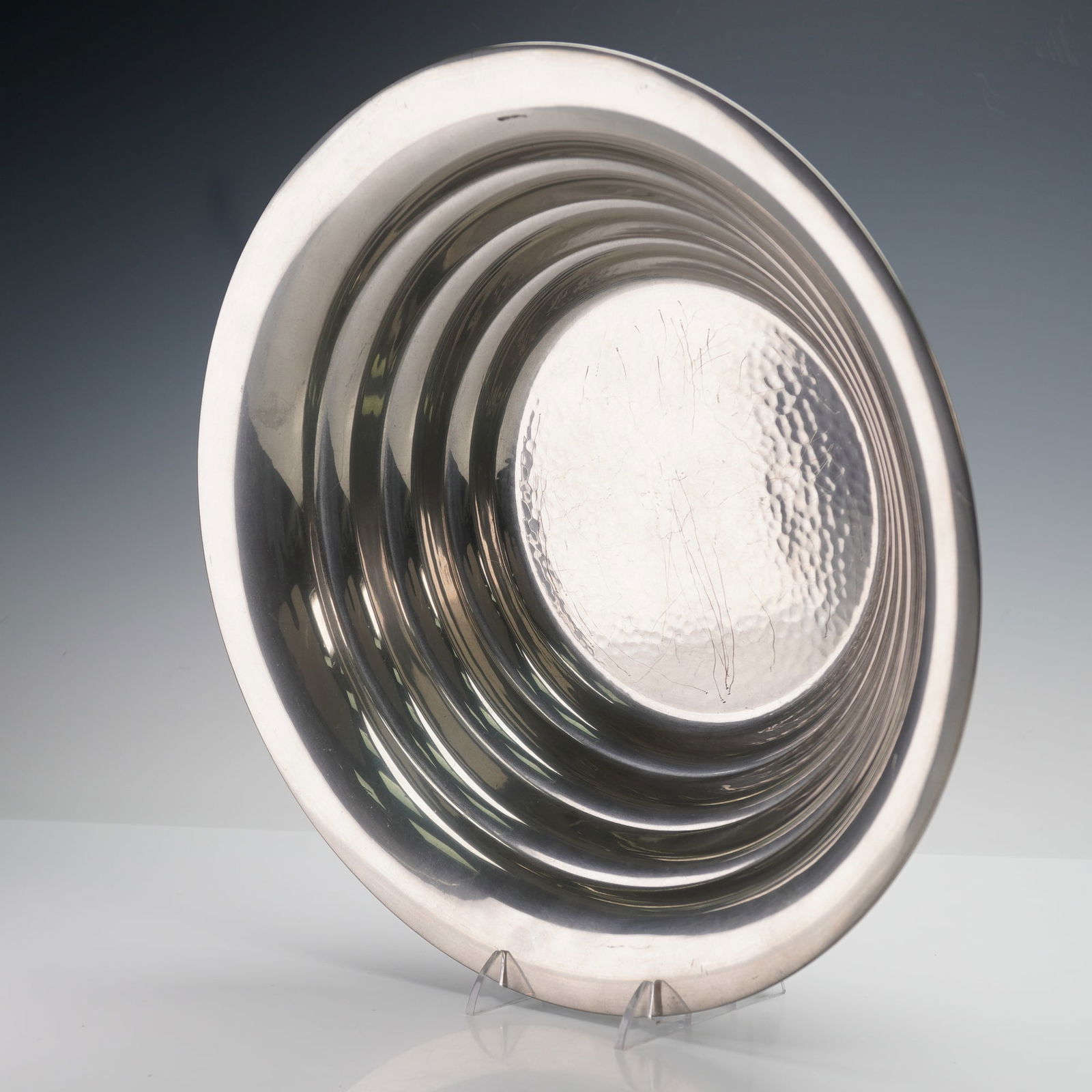 Robert Freitag Hand Made Hammered Metal Bowl: Hand made metal bowl designed by R. Freitag, featuring a modern hammered finish with a series of stepped concentric rings. The underside is stamped "Hand Made Metal Design by R. Freitag" and engraved