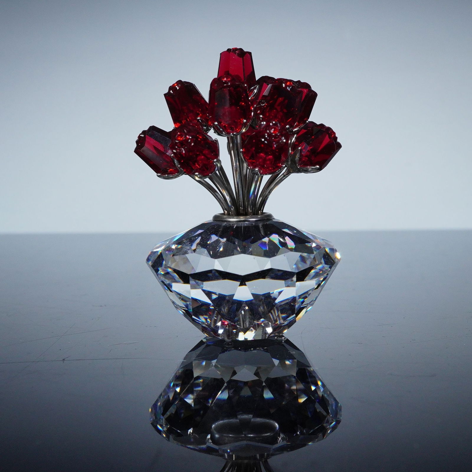 Swarovski Crystal SCS 15th Anniversary Figurine, 2002 Vase of Red Roses: Elegant Swarovski Crystal Society (SCS) 15th Anniversary figurine, issued in 2002 to celebrate the founding of the Swarovski Crystal Society in 1987. Designed by Gabriel Stamey, this striking piece fe