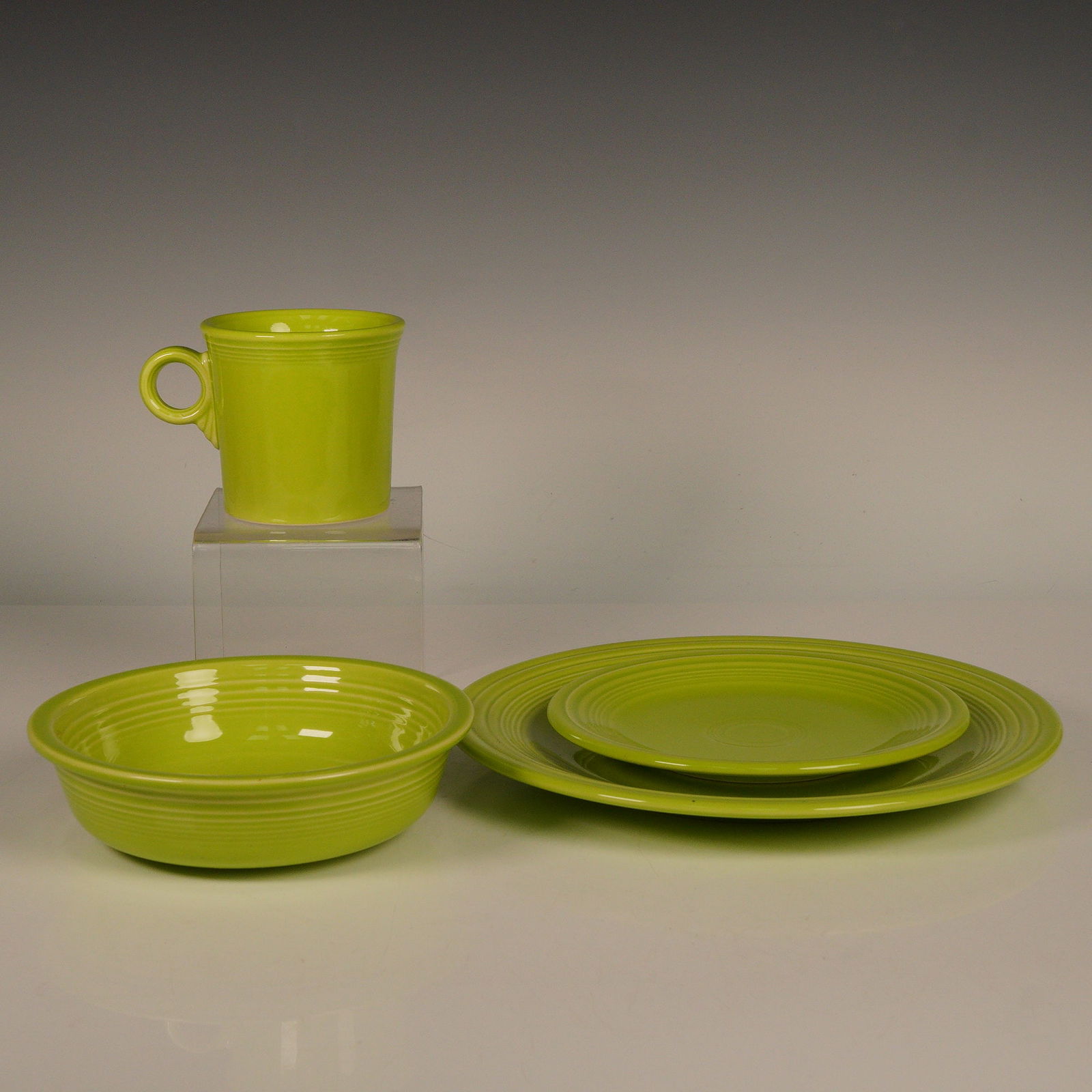 4pc Fiestaware Place Setting by Homer Laughlin China, Chartreuse: This Fiesta 4pc place setting in the vibrant Chartreuse color by Homer Laughlin China includes a dinner plate, salad plate, soup cereal bowl, and a cup. Crafted from durable, lead-free glaze, this set