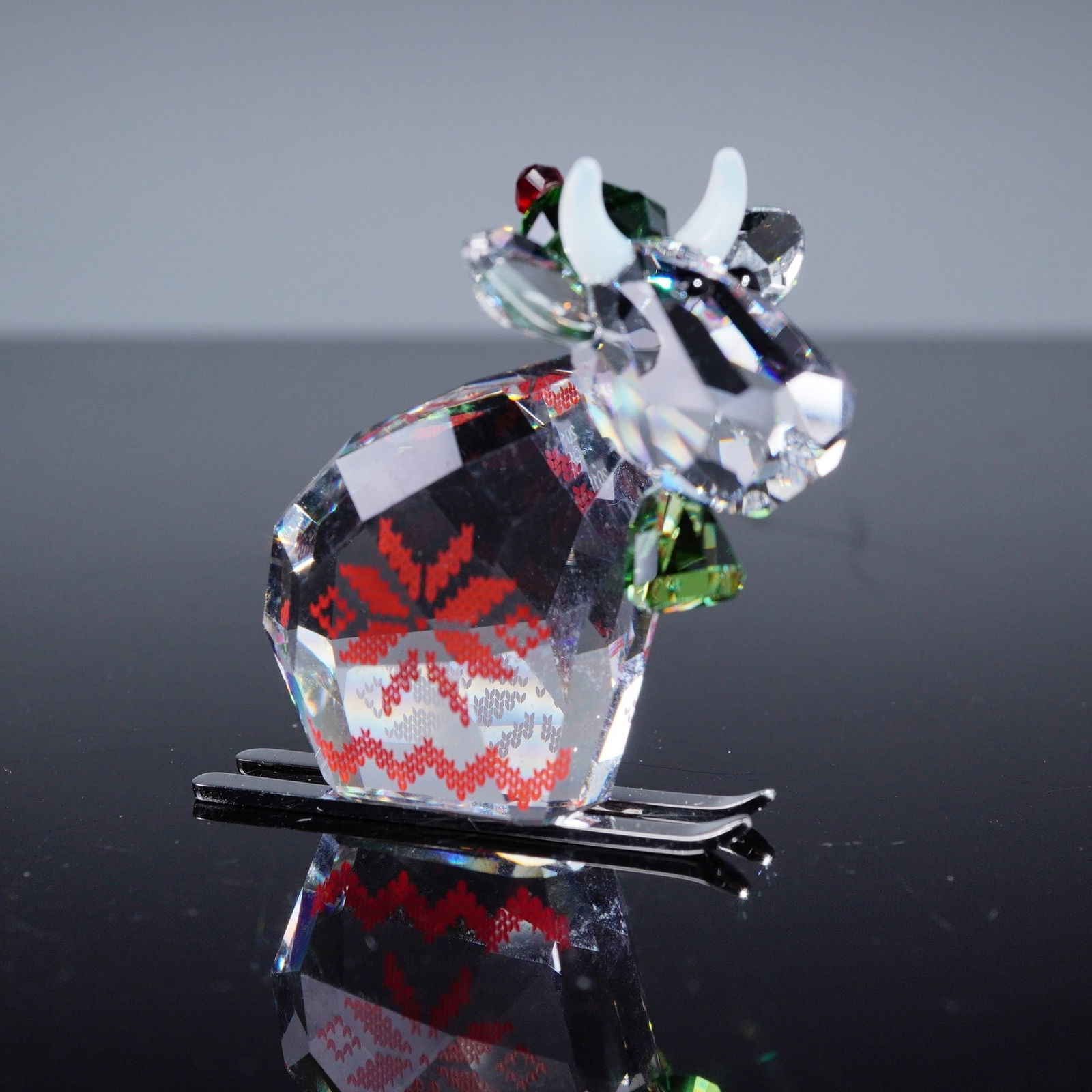 Swarovski Crystal Winter Mo Limited Edition 2019 Figurine, Model 5464859: A Swarovski Crystal 'Winter Mo' Limited Edition 2019 figurine, model number 5464859. This faceted crystal figurine depicts a stylized bovine figure, featuring a clear, multi-faceted body, white horns,