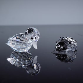 A Pair of Swarovski Crystal Figurines: Duck Swimming and Ladybug