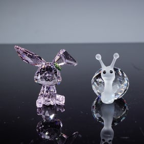A Pair of Swarovski Lucky The Rabbit and Faceted Crystal Snail Figurines