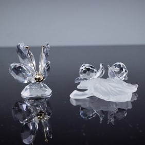 Two Crystal Figurines, including a Swarovski Baby Snails on Vine Leaf