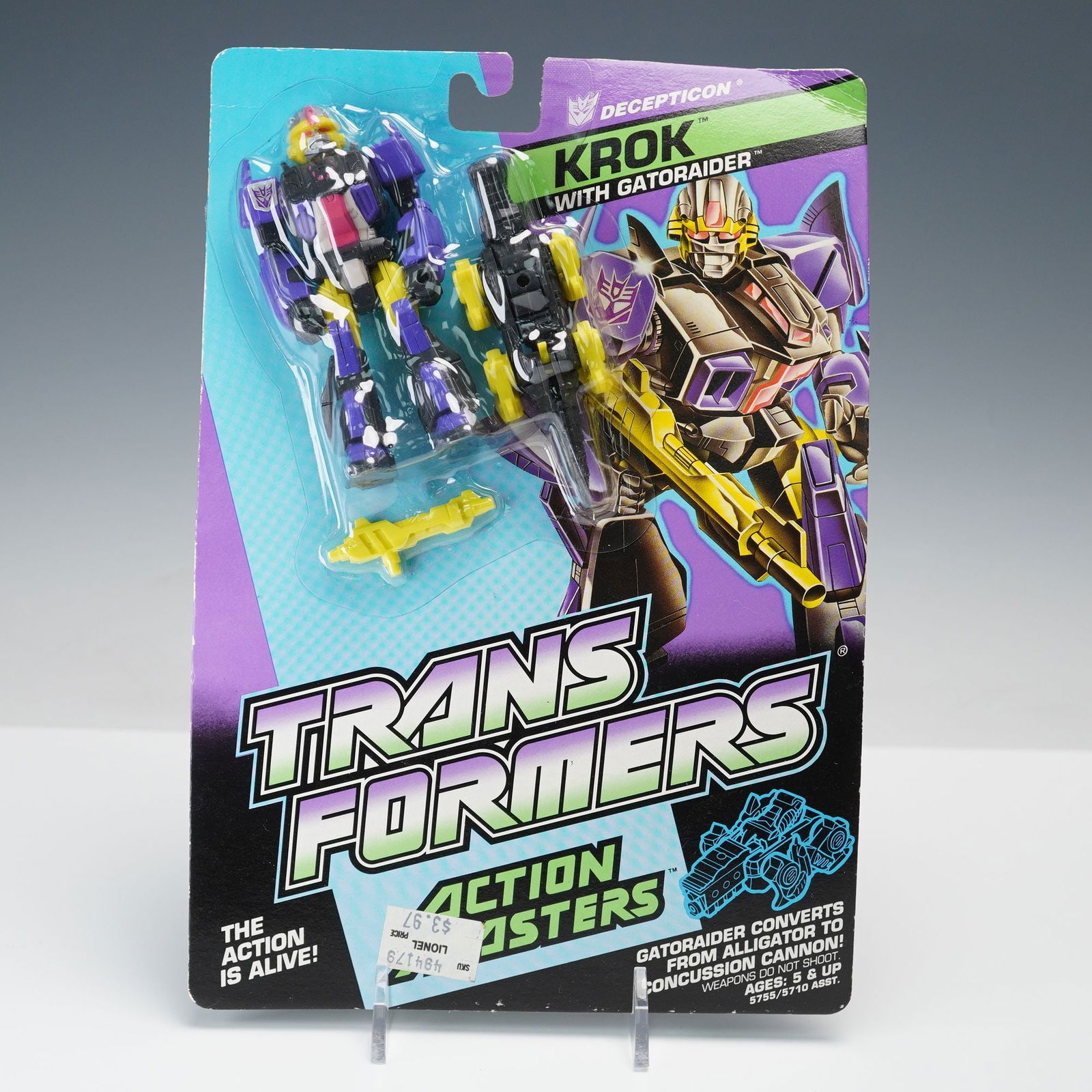 Transformers Action Masters Figurine Decepticon Krok with Gatoraider: Transformers Action Masters Decepticon Krok figure with Gatoraider partner, sealed on original blister card. Gatoraider converts from alligator to concussion cannon. Marked 1989 Hasbro, Inc. Card back