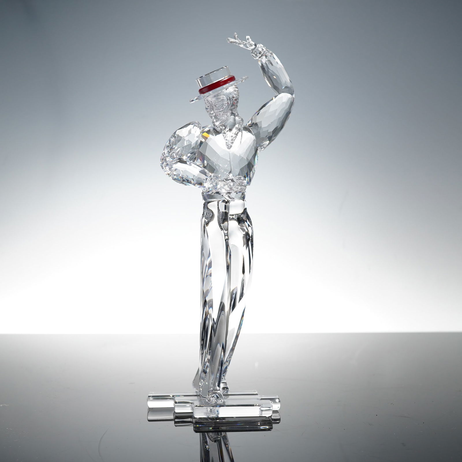 Swarovski Magic of Dance Crystal Figurine, Antonio: A dazzling crystal figurine from the "Magic of Dance" series, depicting Antonio in a graceful mid-dance pose. The piece showcases exquisite faceting throughout the clear crystal form, with detailed sc