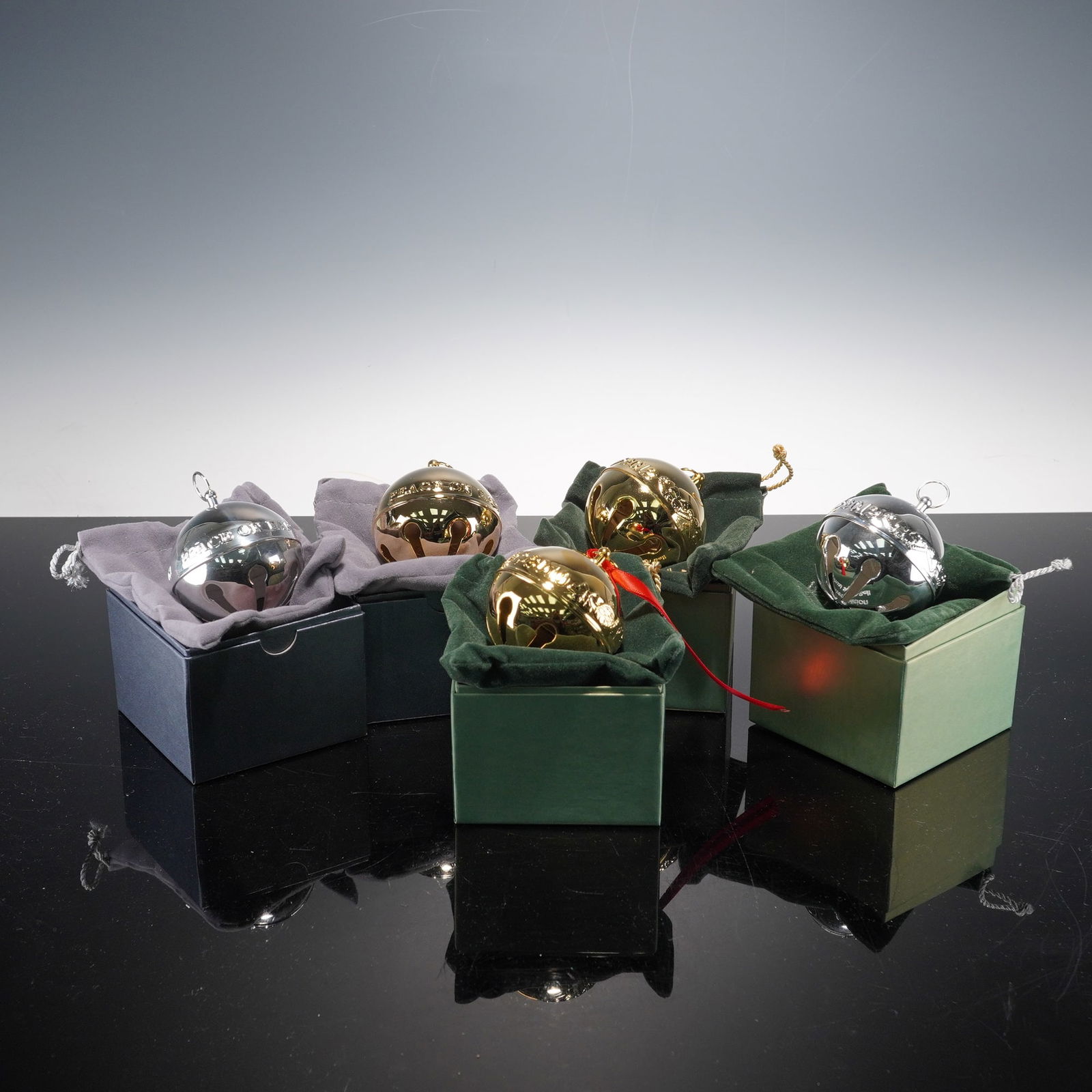 Wallace Silversmiths Gold-Plated & Silver-Plated Ornaments, Annual Bell: Annual Sleigh Bell ornaments, comprising three gold-plated and two silver-plated examples from 2010, 2012, and 2013. Each limited-edition ornament is finely crafted in the traditional bell form with p
